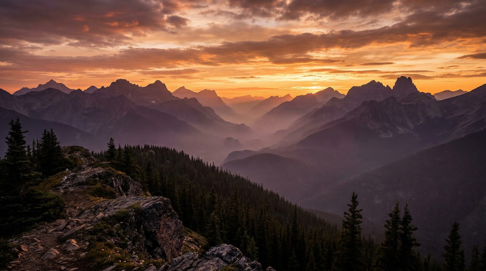 Dramatic mountain peaks at golden sunset | representing the journey to personal clarity